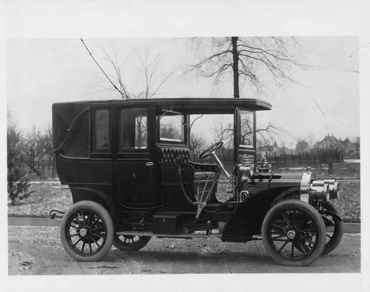 1906 Packard 24 Model S landaulet on street with enclosed backseat