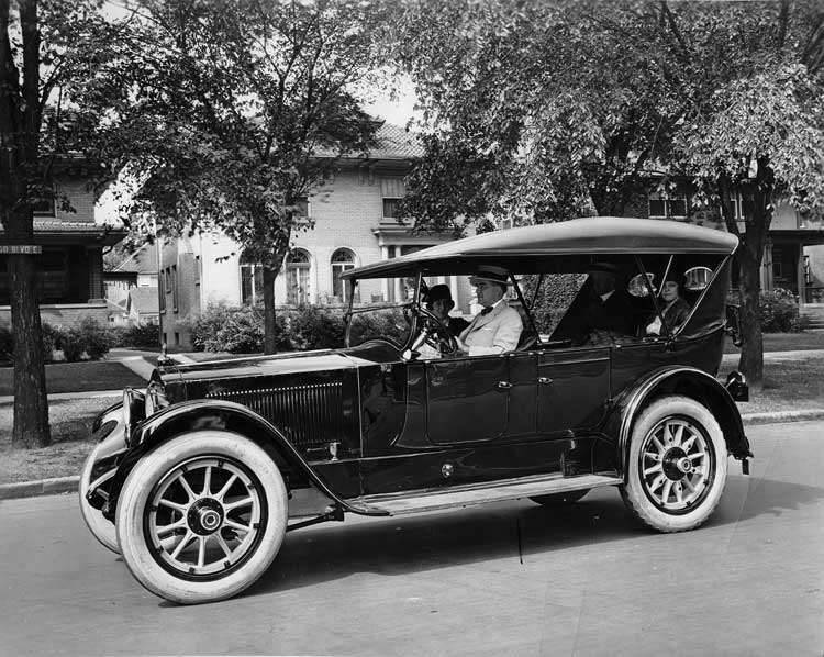 1918-1919 Packard touring car, parked on residential street