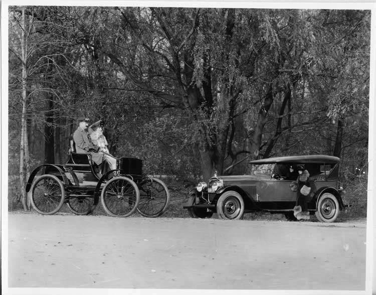 1924 Packard touring car and 1899 Packard model A on wooded road