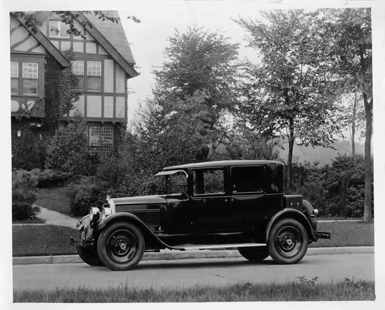1925 Packard left side view, parked on residential street, large home in background