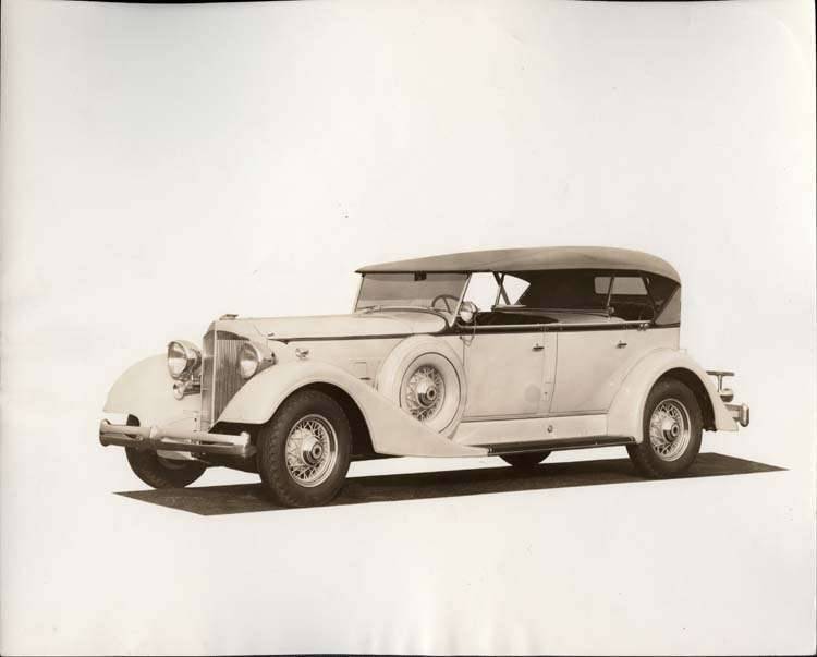1934 Packard sport phaeton, three-quarter left side view, top raised