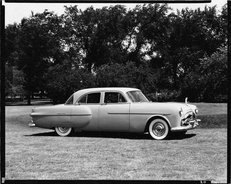 1951 Packard sedan, nine-tenths right side view, parked on grass