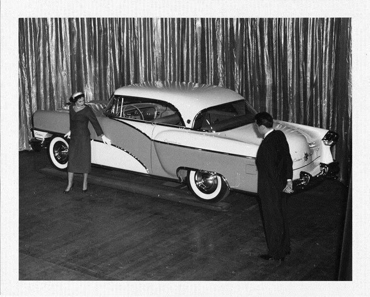 1955 Packard Clipper Constellation on display with man and woman