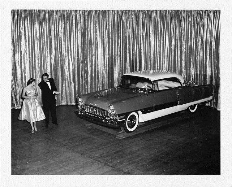 1955 Packard Clipper Constellation, on display, couple standing at front of car