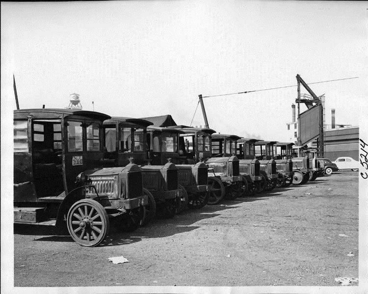 1921-23 Packard trucks for Packard Traffic Division parked in yard