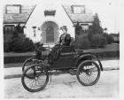 Packard Model A with woman in front of the Lodge