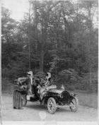 1907 Packard 30 Model U with three passengers and driver in the woods