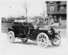 1908 Packard 30 Model UA close-coupled with rumble seat parked on residential street