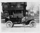 1908 Packard 30 Model UA close-coupled parked in front of brick house