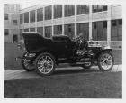1909 Packard 18 Model NA touring car, factory buildings in background