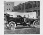 1909 Packard 30 Model UB touring car, right side, brick factory buildings in background