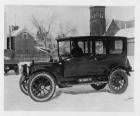 1912 Packard 30 fore-door limousine with tire chains on snow