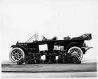 1913 Packard 48 touring car, left side, top folded with traveling cases piled alongside