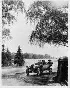1913 Packard 48 phaeton, on country road, male driver, female and male passengers