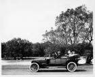 1913 Packard 48 phaeton, male driver, male and female passengers, on Belle Isle