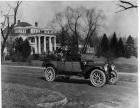 1914 Packard 3-48 touring car on residential street, mansions in background