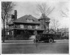 1916 Packard 1-35 touring car, with male driver, parked in front of a residence in Chicago, Ill.