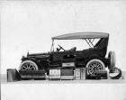 1916 Packard 1-25 touring car, left side, top raised, with several travel trunks