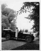 1917 Packard phaeton, parked on pathway, female stepping out of passenger side door