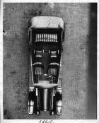 1917 Packard parked on street, view from above, showing seating and steering wheel
