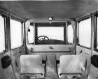1918 Packard imperial limousine, view of interior from back seat, side-folding auxiliary seats visib