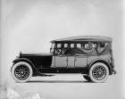 1920 Packard two-toned touring car, top raised, side curtains in place