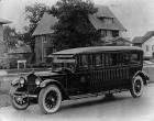 1921 Packard bus conversion parked on residential street