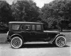 1921 Packard touring car, left side view, parked on road