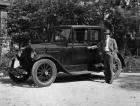 1921-1922 Packard coupe, three-quarter left front view, male owner standing at side