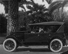 1921-1922 Packard touring car, parked on street, female driver, top raised, left side view