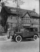 1921-1922 Packard sedan, parked on street in front of home