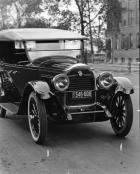 1922 Packard touring car, two-thirds front view, parked on street