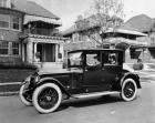 1920-1923 Packard special coupe with female driver parked on residential street