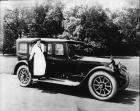 1920-1923 Packard touring car, woman in middy stepping out of passenger door