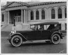 1924 Packard 226 sport model with Harlan Fengler at wheel in front of Bruce Dodson building