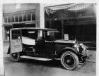 1924 Packard ambulance, doors open, parked on street
