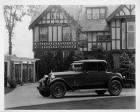 1925 Packard coupe, seven-eights left front view, parked in front of large home
