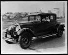 1927 Packard coupe, three-quarter left front view, actress Pauline Starke behind wheel