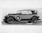 1928 Packard touring car, five-sixth left side view, top raised, side mounted spare tire with fitted
