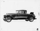 1929 Packard convertible coupe, nine-tenths left front view, top raised, rumble seat open