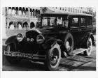 1929 Packard sedan, three-quarter left front view, parked on street