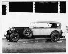1930 Packard two-toned touring car, nine-tenths left side view, top raised