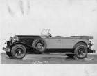 1930 Packard two-toned touring car, nine-tenths left side view, top folded