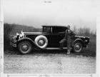 1930 Packard coupe with owner Mr. Lane, foot on running board