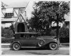 1930 Packard club sedan, right side view, parked on street in front of home