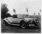 1930 Packard convertible victoria, three-quarter left rear view, top raised
