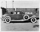 1931 Packard sedan, right side view, other cars and train in background