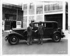 1932 Packard club sedan, left side view, two men standing at driver's door