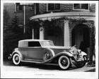1932 Packard convertible victoria parked in front of brick portico