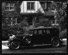 1932 Packard sedan, left side view, parked on street in front of house